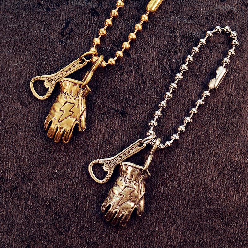 Solid brass motorcycle glove keychain detail view