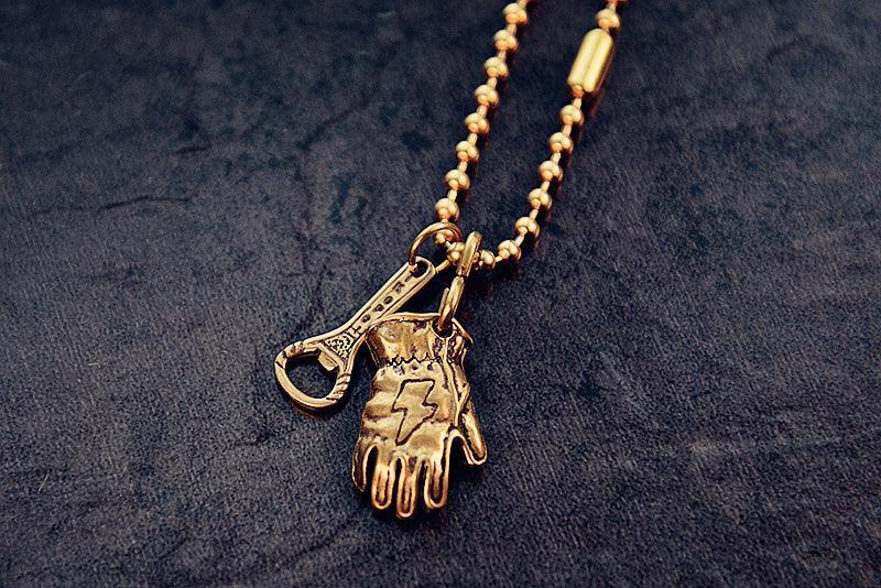 Motorcycle glove brass keychain display detail