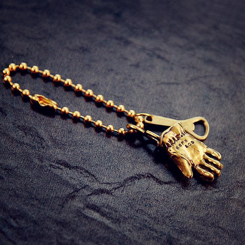 Vintage motorcycle glove solid brass keychain front view