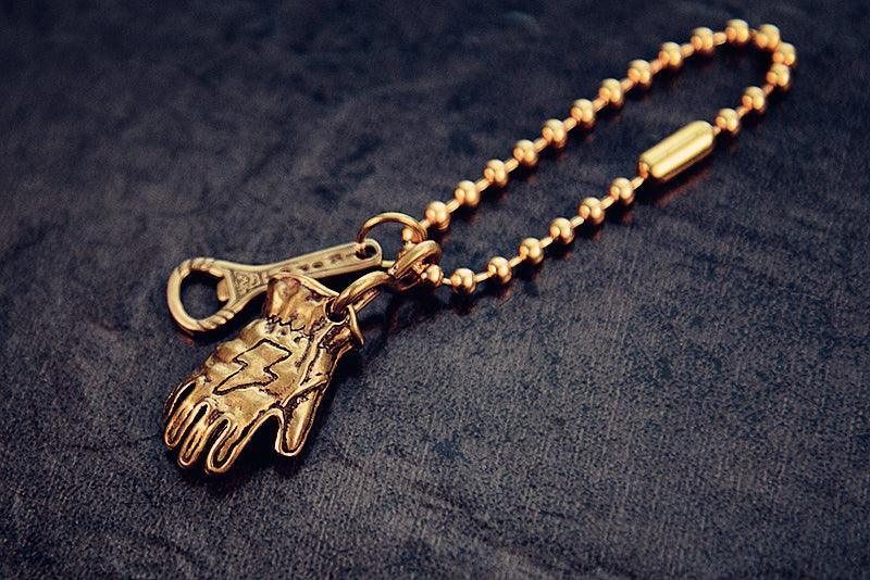 Brass-style motorcycle glove keychain accessory option