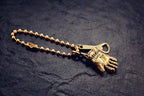 Vintage motorcycle glove keychain close-up on display