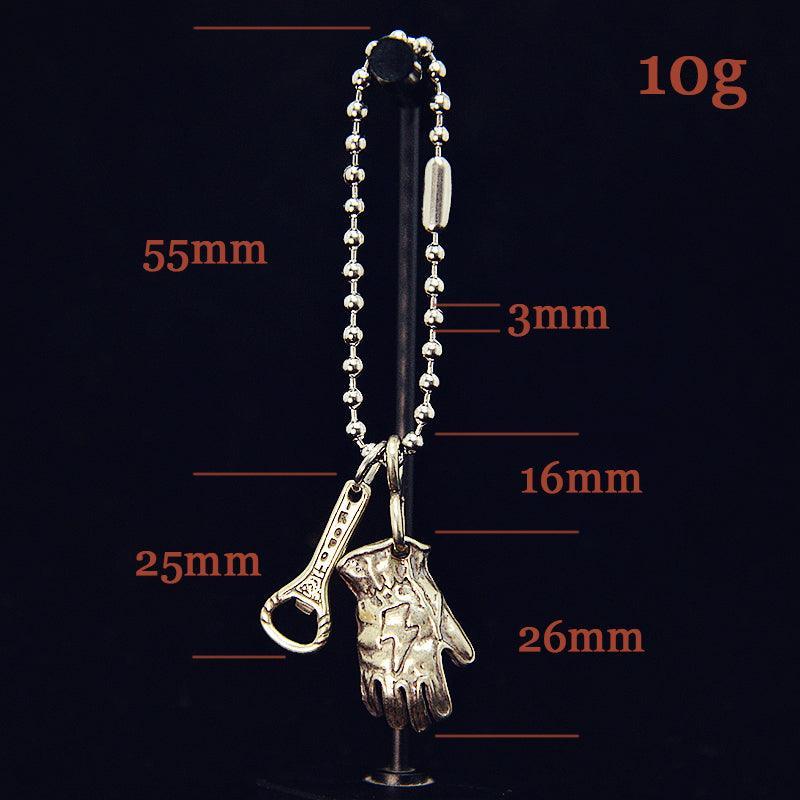 Solid brass motorcycle glove keychain detail angle