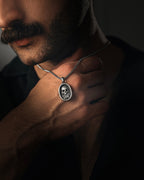 Memento Mori pendant necklace close-up detail