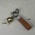 Vintage brass motorcycle helmet keychain size detail