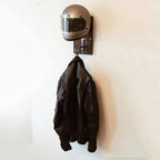 Helmet storage stand for motorcycle gear organization