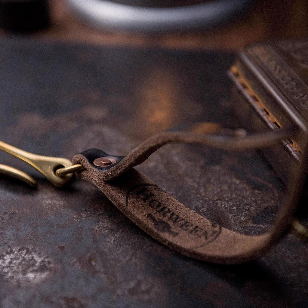 Motorcycle glove clip leather strap detail