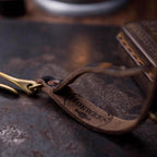 Motorcycle glove clip leather strap detail