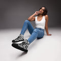 Redacted black women's high-top canvas shoes, front view